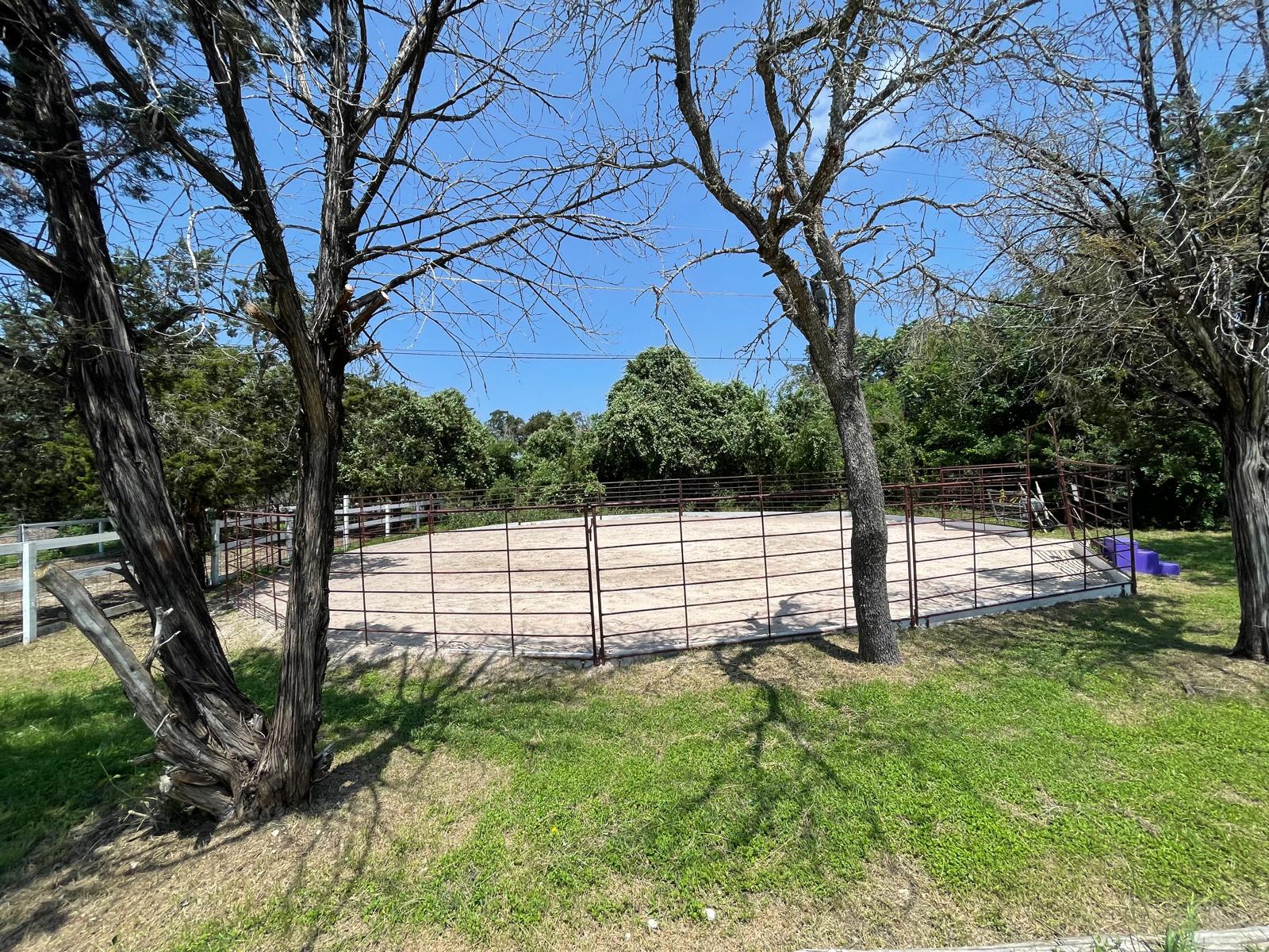 Round pen among the trees